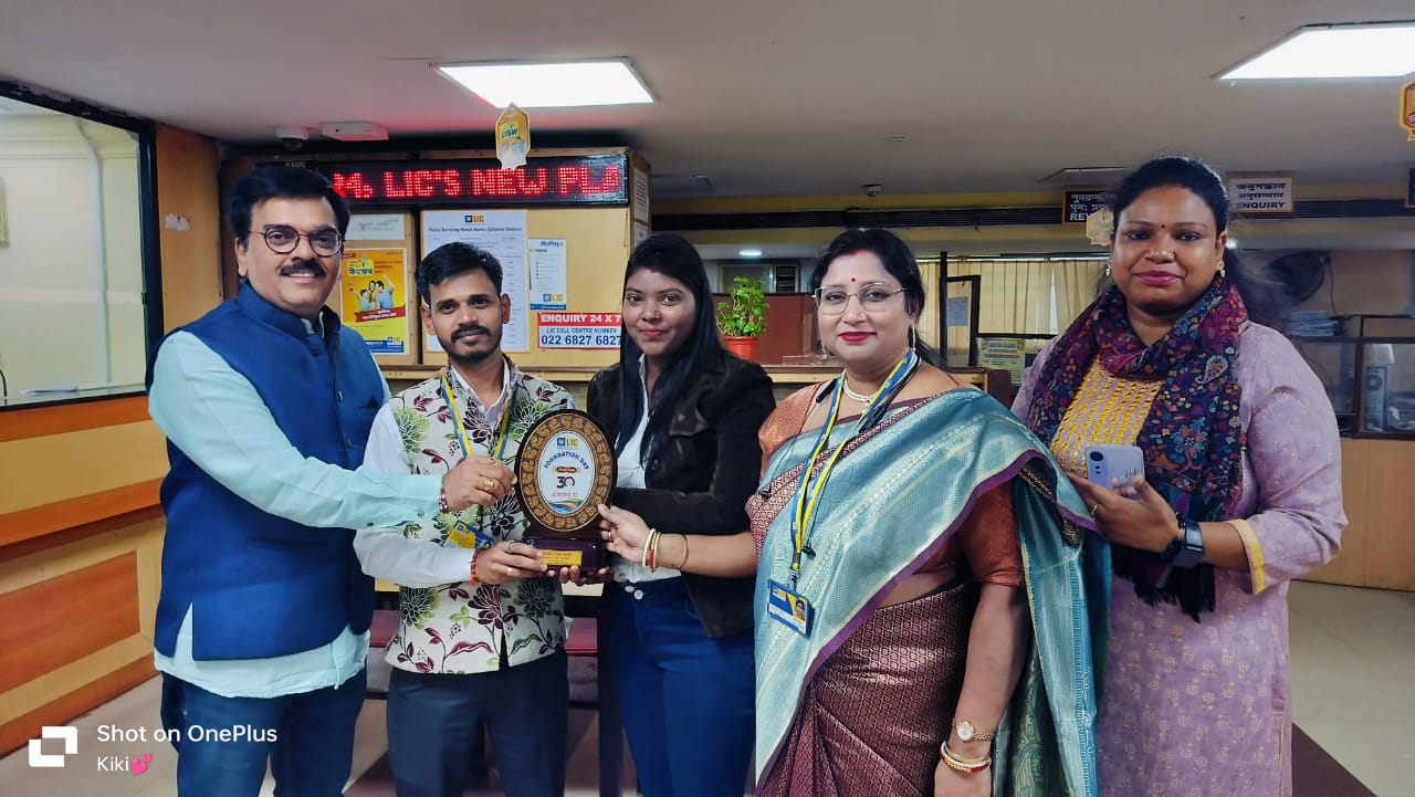 car interior from central back seat position showing driver and blurred view through windscreen of a busy road at night